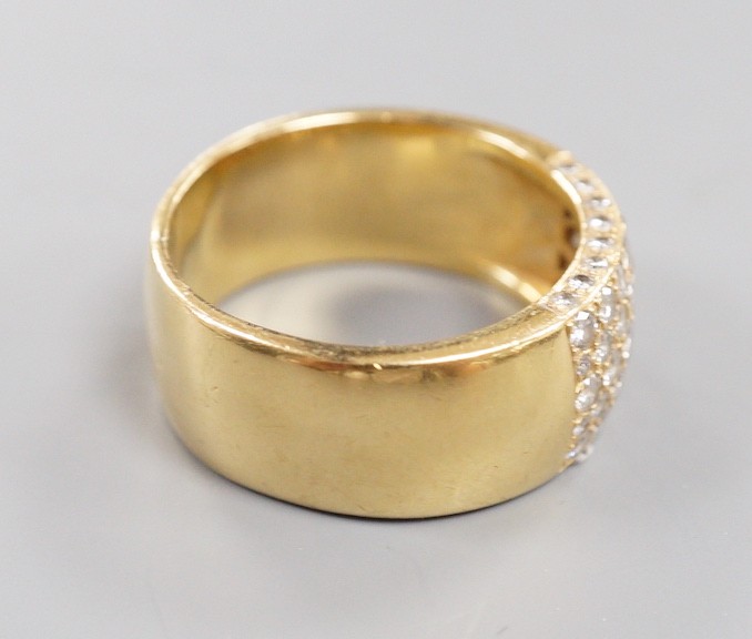 A modern yellow metal (tests as 18ct) and part pave set diamond ring, size R/S gross weight 13.4 grams.